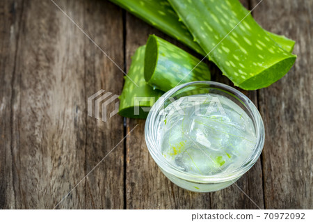 Jelly aloe vera in bowl on wooden tablebackground. 70972092