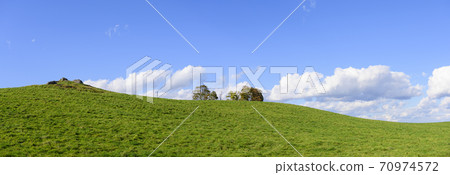 Meadow and blue sky background 70974572