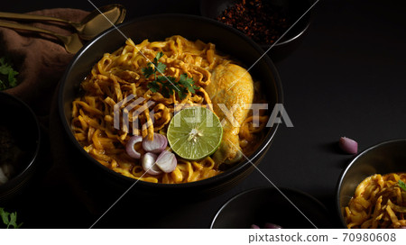 Northern Thai food, Noodles curry soup with Chicken (Khao Soi) serving in restaurant Northern Thai food, Noodles curry soup with Chicken (Khao Soi) serving in restaurant 70980608