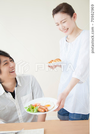 A woman preparing for breakfast A woman preparing for breakfast 70982969