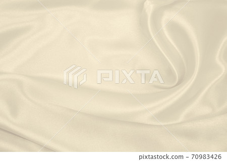 Smooth elegant golden silk or satin luxury cloth texture as wedding background. Luxurious background design. In Sepia toned. Retro style Smooth elegant golden silk or satin luxury cloth texture as wedding background. Luxurious background design. In Sepia toned. Retro style 70983426