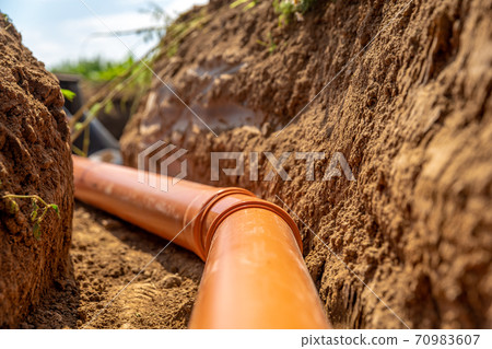 plastic pipes in the ground for wastewater and rainwater 70983607