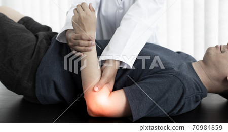 Physical therapists or physicians perform physical therapy for patients admitted to the hospital, Massage or muscle relaxation and physical therapy concept. 70984859