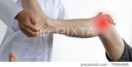 Physical therapists or physicians perform physical therapy for patients admitted to the hospital, Massage or muscle relaxation and physical therapy concept. Physical therapists or physicians perform physical therapy for patients admitted to the hospital, Massage or muscle relaxation and physical therapy concept. 70984866