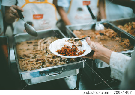 The hands of the poor have been begging to donate food from the donor, The concept of feeding The hands of the poor have been begging to donate food from the donor, The concept of feeding 70985497