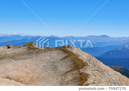 summit ridge with sheer cliffs of Mount Oshten in the western Caucasus 70987276
