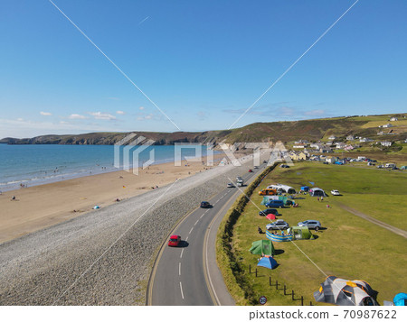 Newgale Beach In Pembrokeshire Is A Huge Sandy Beach Backed With A Pebble Embankment Newgale Beach In Pembrokeshire Is A Huge Sandy Beach Backed With A Pebble Embankment 70987622