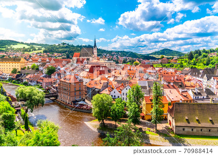 Panoramic view of Cesky Krumlov with St Vitus church in the middle of historical city centre. Cesky Krumlov, Southern Bohemia, Czech Republic Panoramic view of Cesky Krumlov with St Vitus church in the middle of historical city centre. Cesky Krumlov, Southern Bohemia, Czech Republic 70988414