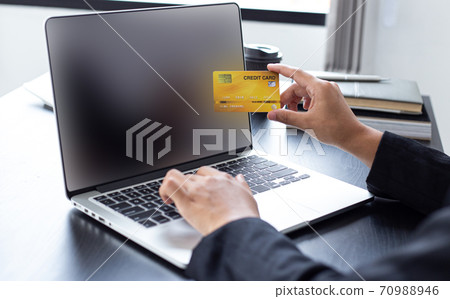 women use laptop to register online purchases using credit card payments, Convenience in the world of technology and the internet, Shopping online and banking online concept. women use laptop to register online purchases using credit card payments, Convenience in the world of technology and the internet, Shopping online and banking online concept. 70988946