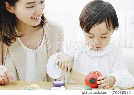 Parent and child playing with toys Parent and child playing with toys 70988983