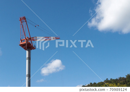Construction site crane and blue sky and white clouds 70989124