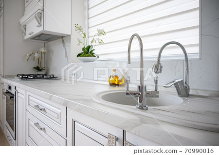 Luxury modern classic white kitchen interior Luxury modern classic white kitchen interior 70990016