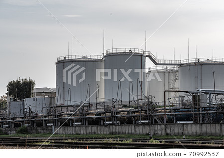 Tanks oil storage against the solf sky. Storage tanks for petroleum products. Equipment refinery. 70992537
