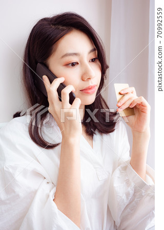 Young asian beauty shopping with cellphone and credit card Young asian beauty shopping with cellphone and credit card 70992559