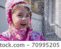 emotional portrait of cute little girl in winter 70995205