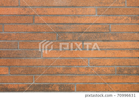 Texture and background of a plastered wall with a decorative brown surface and imitation of brickwork. Texture and background of a plastered wall with a decorative brown surface and imitation of brickwork. 70996631