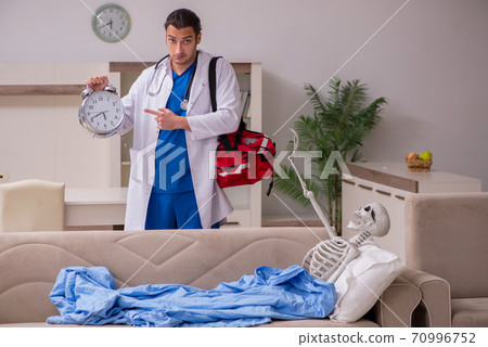 Young male paramedic visiting skeleton patient Young male paramedic visiting skeleton patient 70996752