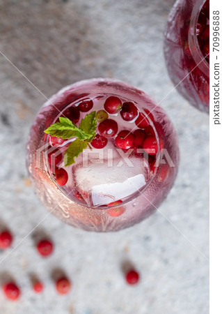Water with ice, wild cranberries and peppermint Water with ice, wild cranberries and peppermint 70996888