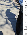 shadow of a person on a wooden board 70997123