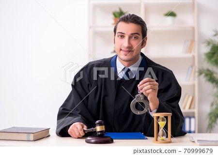 Young male judge in time management concept 70999679