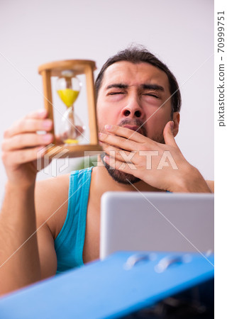 Young man working from house during pandemic Young man working from house during pandemic 70999751