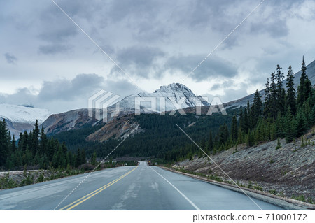 Snow-capped Wilcox Peak in late autumn season. Seen from the Icefields Parkway (Alberta Highway 93), Jasper National Park, Canada. Snow-capped Wilcox Peak in late autumn season. Seen from the Icefields Parkway (Alberta Highway 93), Jasper National Park, Canada. 71000172