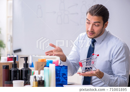 Young male shopaholic in e-commerce concept 71001895
