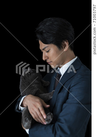 A man holding a cat A man holding a cat 71003797