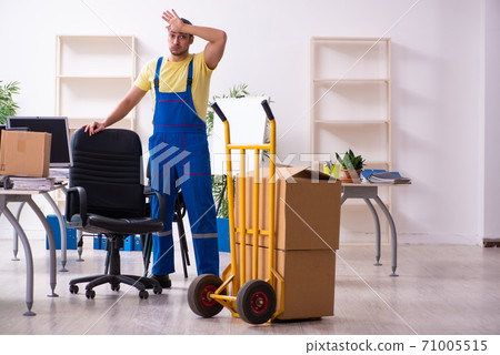 Young male contractor in moving concept Young male contractor in moving concept 71005515