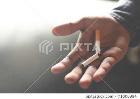 A new generation of businessman refusing cigarette 71006984