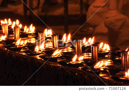 The flame of the candle at night The flame of the candle at night 71007126