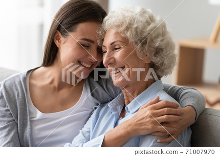 Positive old grandma and young granddaughter bonding at home Positive old grandma and young granddaughter bonding at home 71007970
