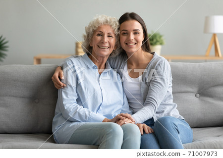 Happy affectionate two generation women grandmother and granddaughter portrait Happy affectionate two generation women grandmother and granddaughter portrait 71007973