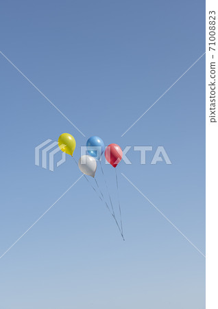 Blue, yellow, white and red balloons floating in the blue sky Blue, yellow, white and red balloons floating in the blue sky 71008823