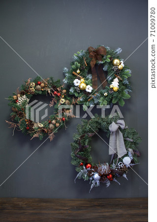 Christmas wreaths decorated with fir branches, Christmas balls and natural materials, New Year 71009780