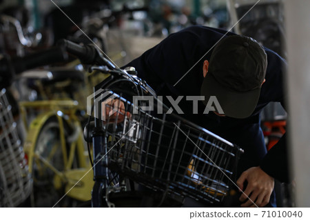 A man looking for a bicycle A man looking for a bicycle 71010040