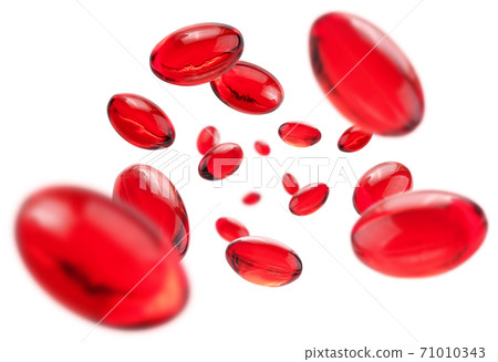 Red capsules levitate on a white background 71010343