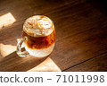 espresso shot mixed with soda on bottom in transperant glasses mug with coffee bubble on wooden table in morning light refreshment stock photo 71011998