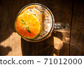espresso shot mixed with soda on bottom in transperant glasses mug with coffee bubble topping by orange mint on wooden table in morning light refreshment stock photo 71012000