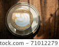 cup of latte art top view in coffee dish on old wood table refresh in morning light stock photo 71012279