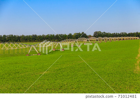 Large agricultural irrigation system in a field 71012481