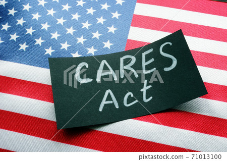 USA flag and word CARES act The Coronavirus Aid, Relief, and Economic Security Act. USA flag and word CARES act The Coronavirus Aid, Relief, and Economic Security Act. 71013100