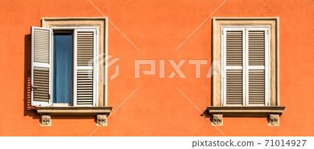 Window in a orange wall Window in a orange wall 71014927