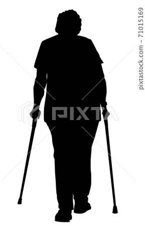 Silhouette of an elderly woman advancing with crutches 71015169