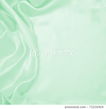 Smooth elegant green silk or satin luxury cloth texture as abstract background. Luxurious background design Smooth elegant green silk or satin luxury cloth texture as abstract background. Luxurious background design 71016404