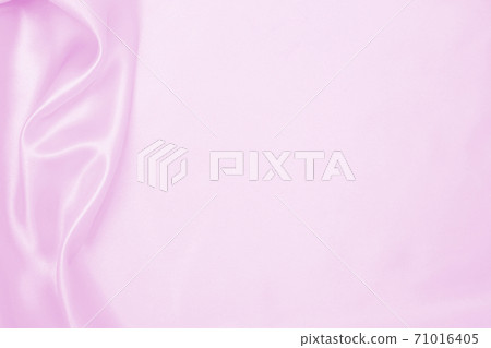 Smooth elegant pink silk or satin texture as wedding background. Luxurious background design Smooth elegant pink silk or satin texture as wedding background. Luxurious background design 71016405
