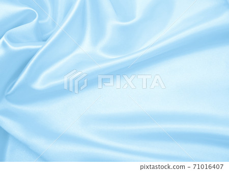 Smooth elegant blue silk or satin luxury cloth texture as abstract background. Luxurious background design 71016407