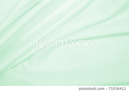 Smooth elegant green silk or satin luxury cloth texture as abstract background. Luxurious background design Smooth elegant green silk or satin luxury cloth texture as abstract background. Luxurious background design 71016412