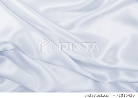 Smooth elegant grey silk or satin luxury cloth as wedding background. Luxurious background design Smooth elegant grey silk or satin luxury cloth as wedding background. Luxurious background design 71016420