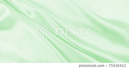 Smooth elegant green silk or satin luxury cloth texture as abstract background. Luxurious background design Smooth elegant green silk or satin luxury cloth texture as abstract background. Luxurious background design 71016422
